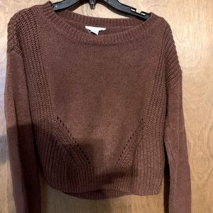 Women’s sweater. It is a shorter sweater. Very cute with jeans and boots!